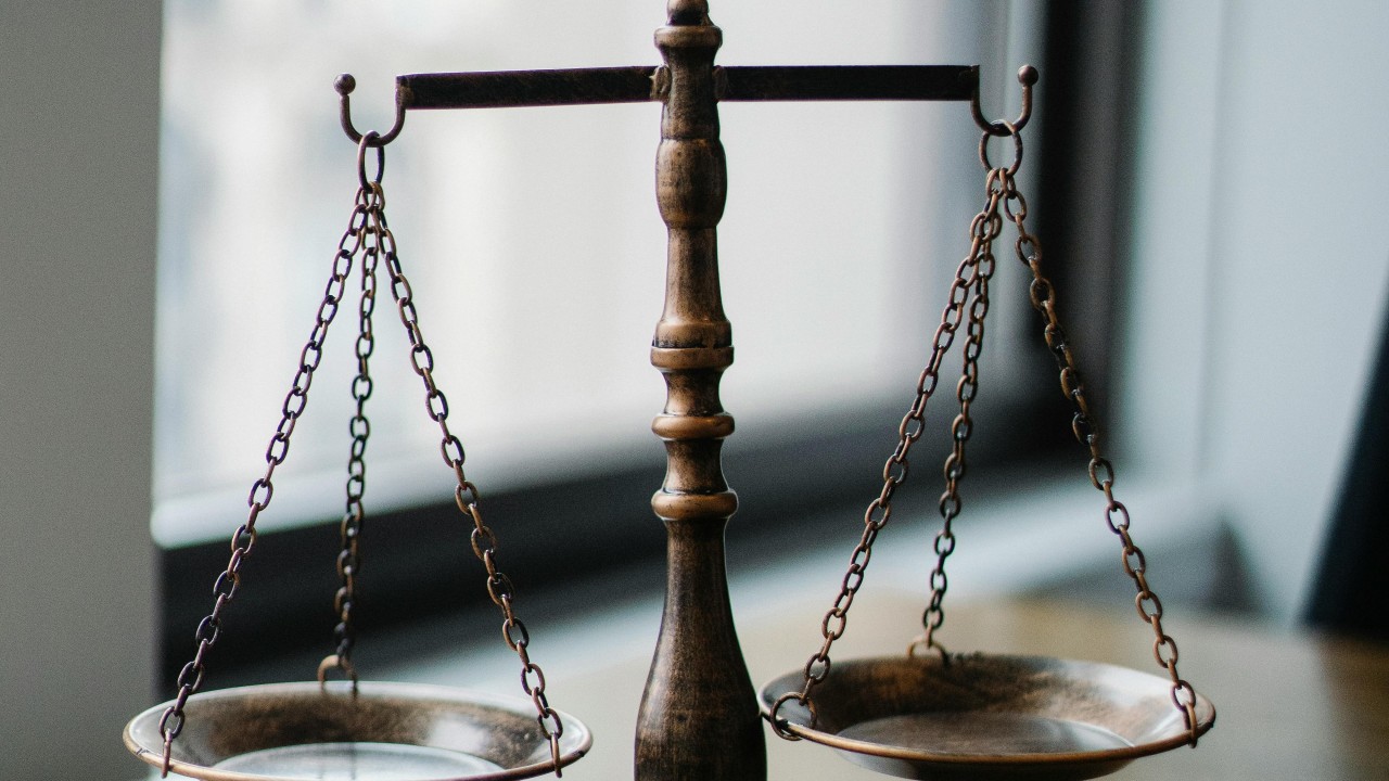 A balance scale illustrating the relationship between innovation and oversight