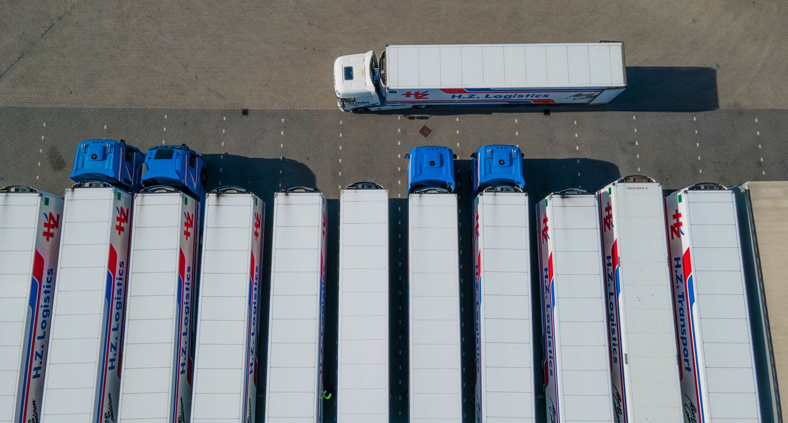 Trucks parked in a fleet yard.