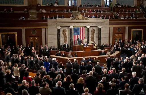 Members gathered on the floor of the U.S. House of Representatives chamber