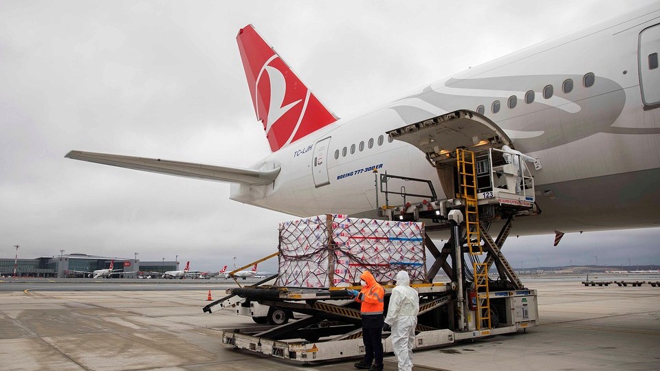 Cargo pallet being loaded into an aircraft at an airport